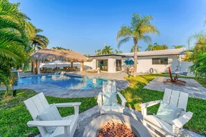 Relax by the firepit next to the pool, where the calming sounds of the water and the warmth of the flames create the perfect atmosphere."