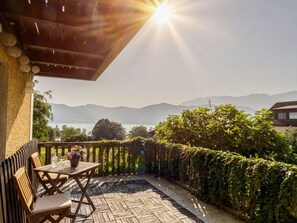 Sky, Plant, Light, Building, Sunlight, Grass, Shade, Wood, Outdoor Furniture, Tree