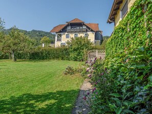 Plant, Sky, Property, Natural Landscape, Land Lot, Vegetation, Building, Grass, Tree, Cottage