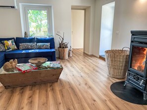Property, Couch, Wood, Comfort, Flooring, Interior Design, Floor, Living Room, Window, Building