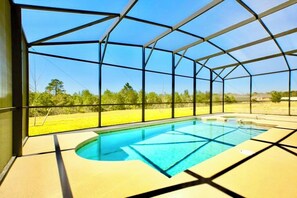 A beautiful private pool and spa with views over the conservation area
