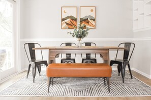 The cute dining area is perfect for enjoying meals or hosting game nights with family and friends