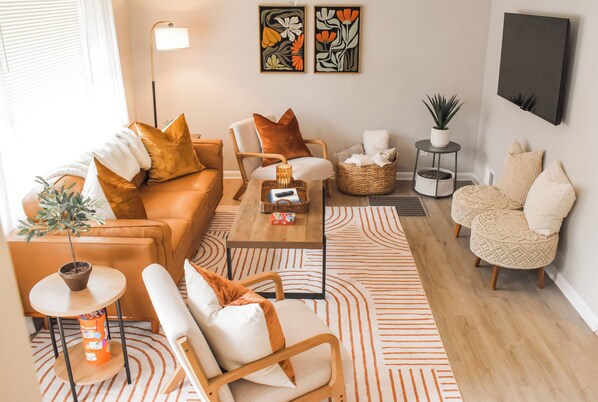 The heart of the home, this spacious living area boasts comfortable seating and a Smart TV. It’s als