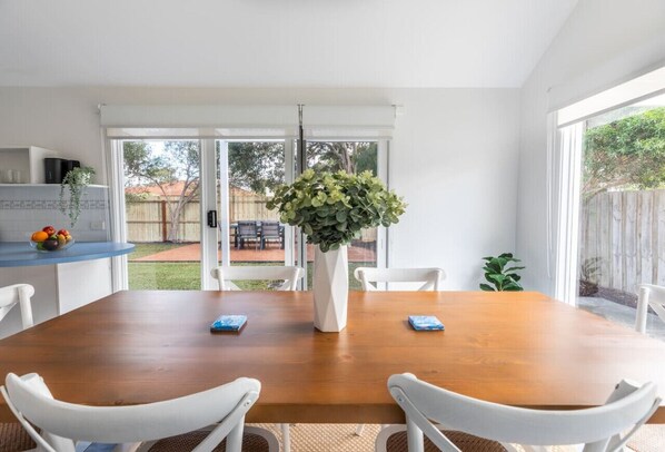 Dining with a view to spacious backyard