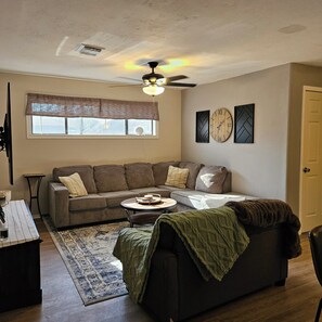 Livingroom showing entry door to right.