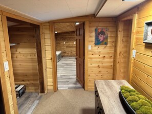 Hall connecting mudroom and living room to kitchen