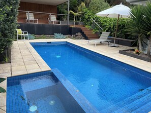 8 metre solar heated pool, and gas heated spa. 
Cabana in the background