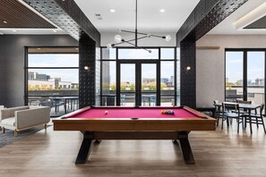 Pool table available in our building's shared rooftop lounge with high-end amenities and a beautiful view of the city.