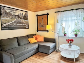 Furniture, Picture Frame, Couch, Property, Plant, Interior Design, Living Room, Wood, Floor, Studio Couch