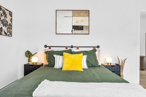 2nd Bedroom features a queen-sized bed with Green Tea memory foam mattress, comfortable reading chair, smart TV and closet space