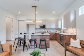 Enjoy the versatility of the kitchen island, perfect for meal prep and entertaining.