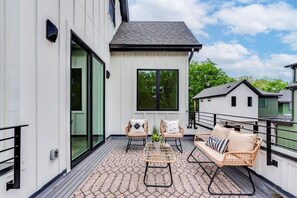A cozy porch provides the perfect space for outdoor lounging.