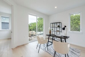 The home office features a functional setup, ideal for efficient remote work.