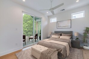 Enjoy the light-filled bedroom with direct access to a relaxing balcony.