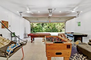 Fun game room with game tables, Smart TV, and lounge area to enjoy. Heater for the winter.