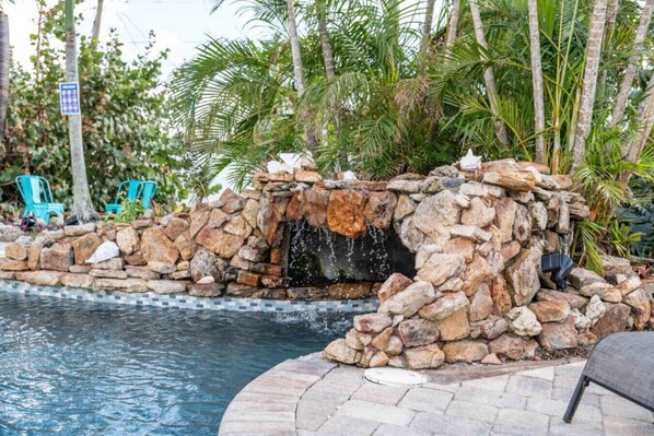 The highlight of this fabulous home is the Grotto pool waterfall.