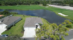 Water & Golf surround this gorgeous home.