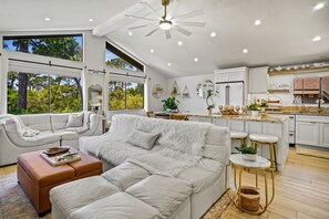 Open living area with vaulted ceilings