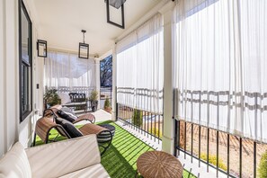 Front covered porch - adjustable lighting and privacy curtains