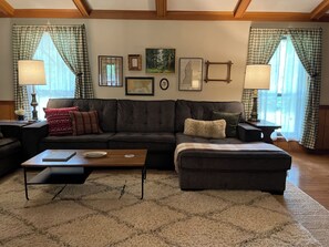 Living room features two large sectionals with chaises.