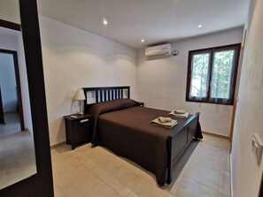 Double bedroom with king size bed, aircon and ensuite shower room