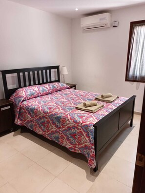 Double bedroom with king size bed, aircon and ensuite shower room