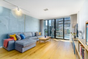Enjoy a light-filled, spacious lounge with modern furnishings and large windows that bring in plenty of natural sunlight. A cosy and stylish space, perfect for relaxation or entertaining.