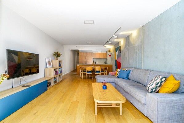 Enjoy a light-filled, spacious lounge with modern furnishings and large windows that bring in plenty of natural sunlight. A cosy and stylish space, perfect for relaxation or entertaining.