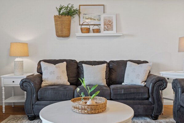 Open living space with Queen sofa sleeper, Smart TV, and balcony access