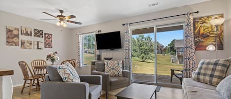 Spacious living room with access to patio