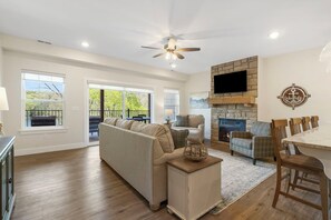 Relax in the Living Room with a movie, curl up with a book, or gather to play a board game without missing out on the view