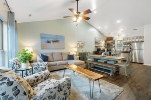 The spacious, airy Living/Dining Room and Kitchen offer abundant space, light, and amenities