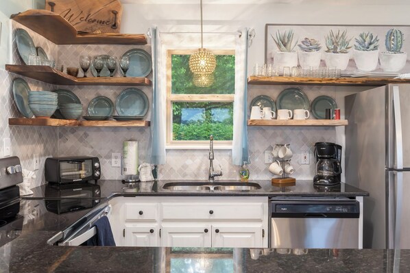 Enjoy tranquil finishes and all the comforts of home in the beautiful open Kitchen