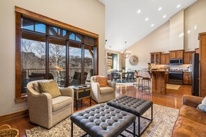Bright living space with ample seating and TV