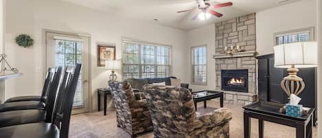 Modern spacious living area with TV and fireplace