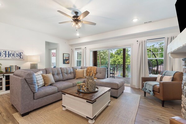 Curl up for a movie or a snooze by the fireplace on the queen sleeper sofa