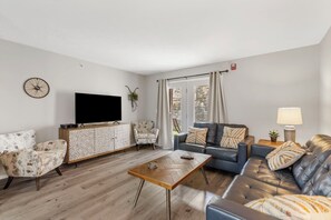 Unit 2: Cozy and spacious living area with TV