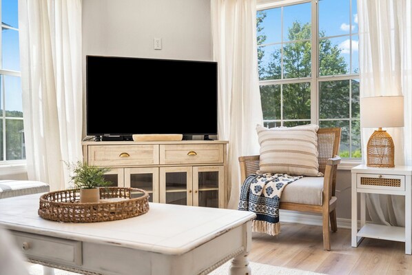 Curl up for a movie or a show in the airy, comfortable living room