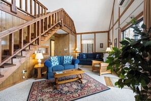 Cozy and spacious living area with TV and fireplace