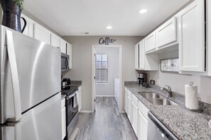 Full kitchen with stainless-steel appliances