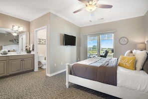Bedroom 2 with King bed, Smart TV, Sunroom access, and private en-suite