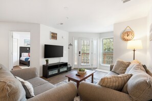 Open living space with comfy seating and, Smart TV