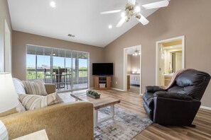 Living room with near floor to ceiling outlook of Branson views