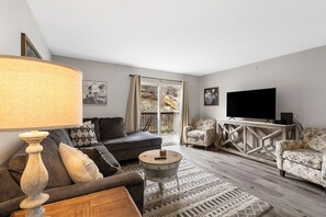 Cozy and spacious living area with TV