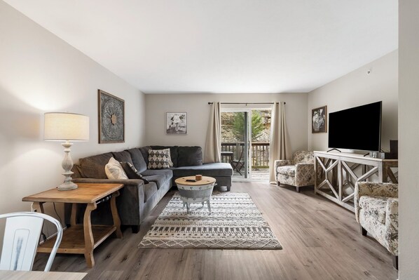 Cozy and spacious living area with TV