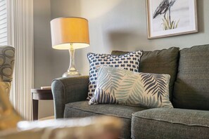 Cozy and spacious living area with TV and fireplace