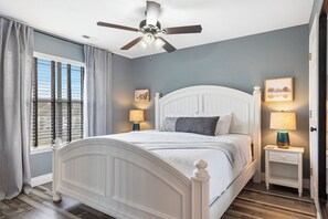 The king suite showcases a private ensuite, TV, & sunroom access