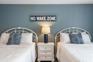 The 1st bedroom retreat boasts a pair of queen beds, private ensuite, & TV