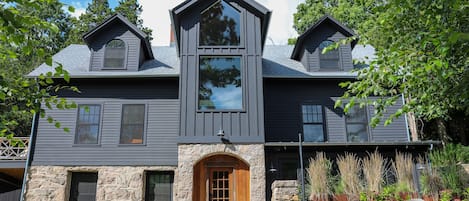 Front door and outdoor patio to lower level luxury apartment.