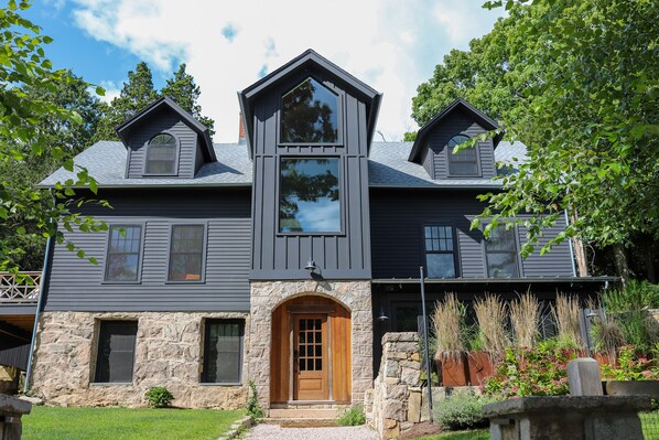 Front door and outdoor patio to lower level luxury apartment.